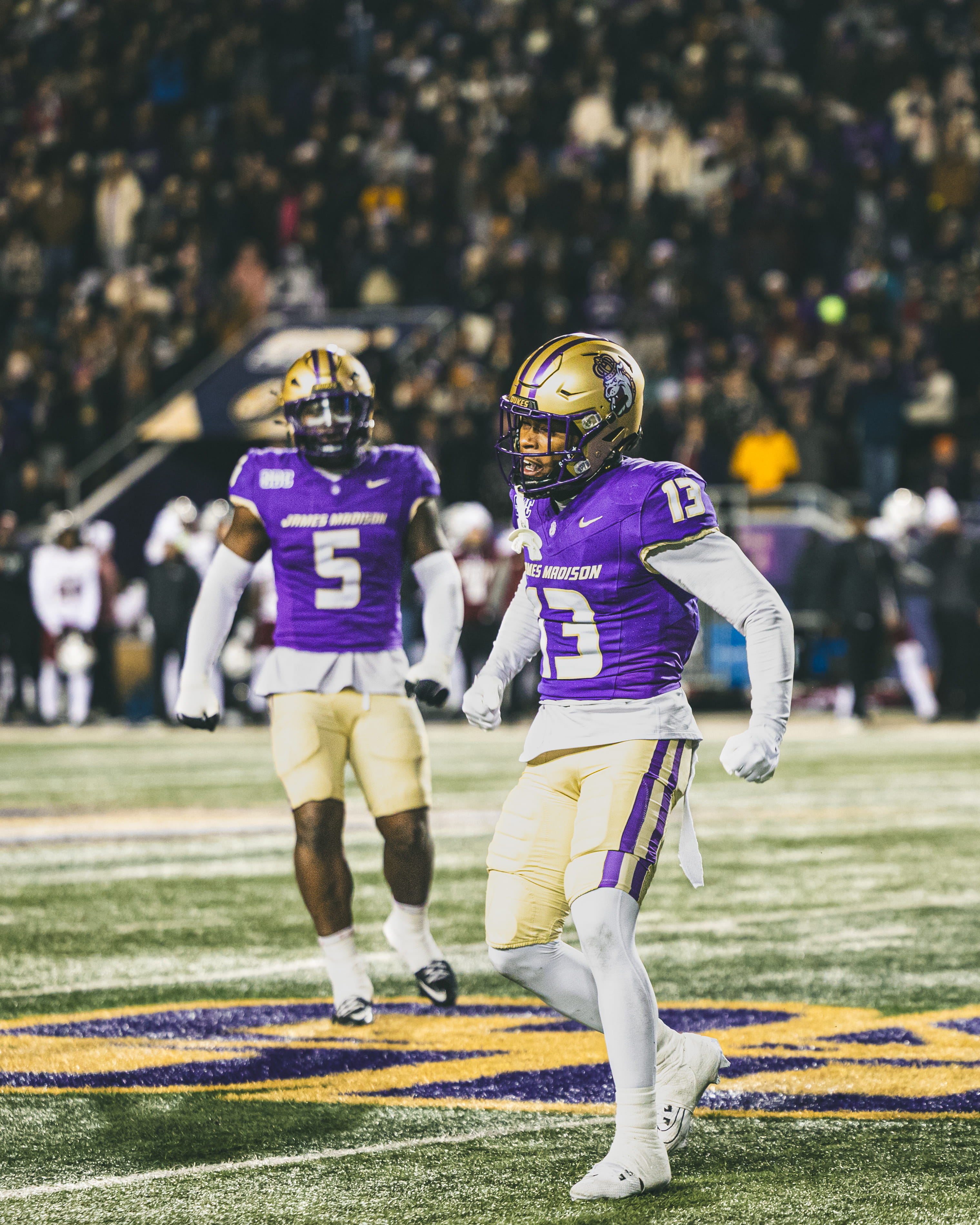 JMU football player running across the end zone